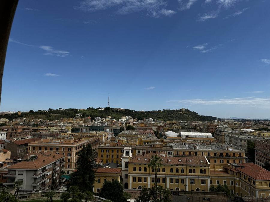 Rooftops of Rome under a blue sky